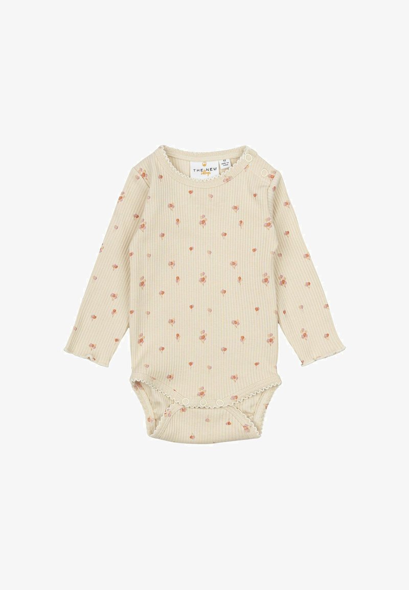 Ribbed pitkähihainen bodysuit vaaleassa beigessä, jossa on vaaleanpunainen kukkakuosi; siinä on nepparit ja aallotettu viimeistely kaula-aukon ja lahkeiden reunassa.