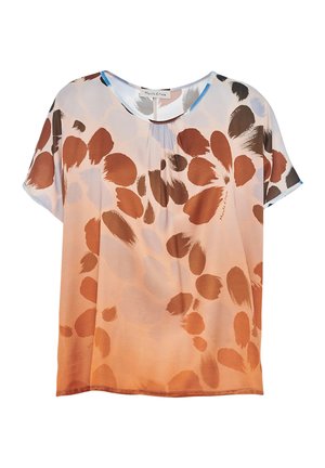 Blouse légère présentant un dégradé de doux orange à beige, ornée de motifs floraux abstraits marron et bleu. Manches courtes, col rond.