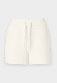 Shorts couleur crème en tissu doux, dotés d'une taille élastique avec cordons de serrage et d'un petit logo sur le côté.