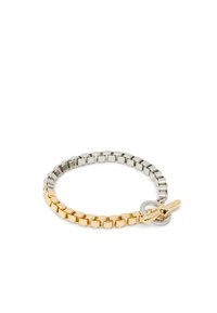 Bracciale bicolore con alternanza di maglie in metallo oro e argento, dotato di chiusura a toggle e superficie liscia.