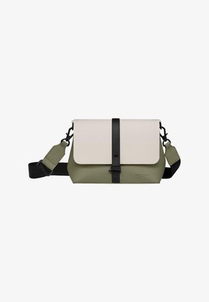 Crossbody bag in olive green and cream, made of durable material. Features a black strap and snap closure with a minimalist design.