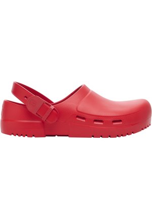 Red rubber clog with adjustable heel strap, ventilation slots on the sides, and a textured sole for grip.