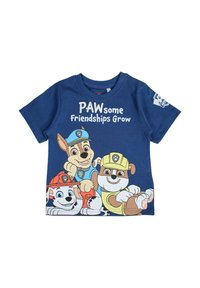 T-shirt en coton bleu avec des personnages de chiens de dessin animé, portant le texte "Des Amitiés Pattes à Pattes" en blanc au-dessus d'eux. Manches courtes et encolure ronde.