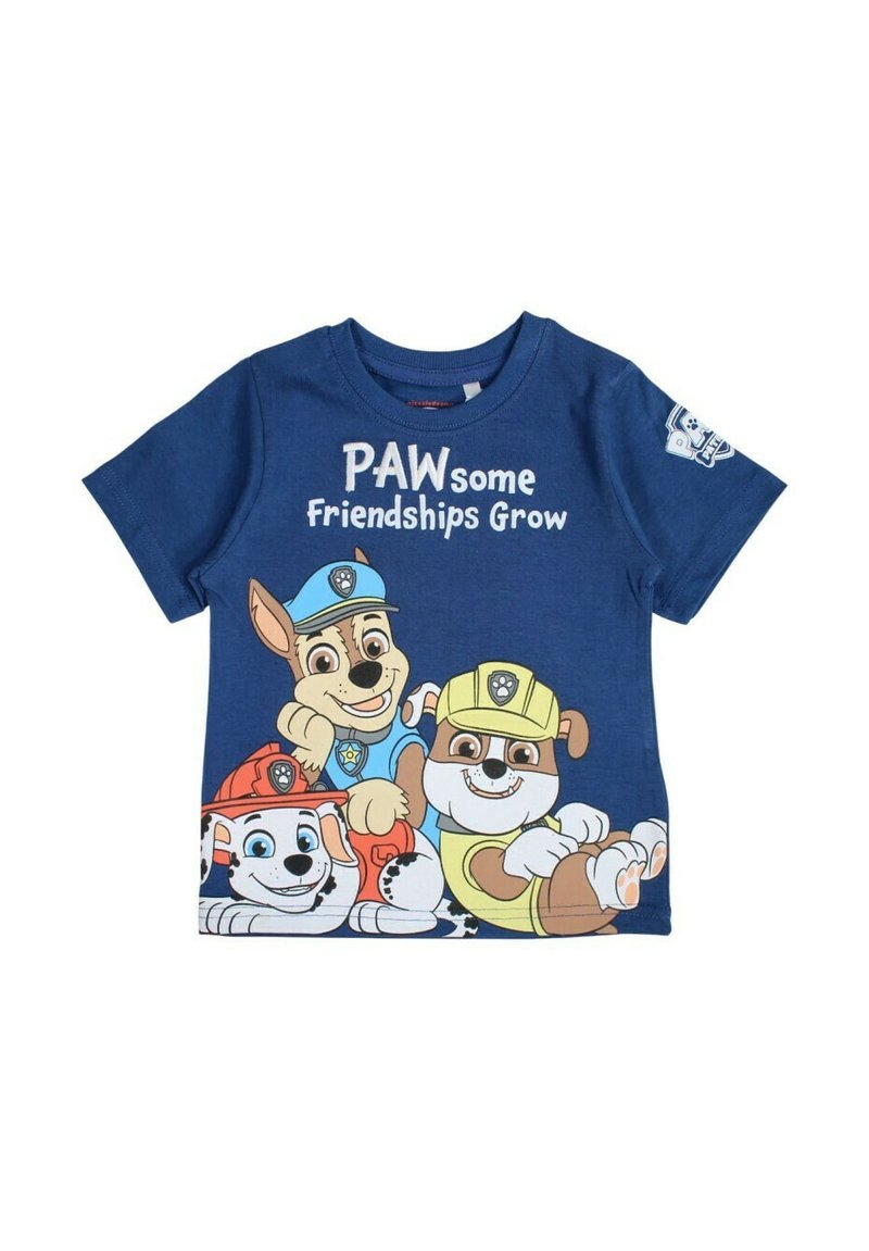 T-shirt en coton bleu avec des personnages de chiens de dessin animé, portant le texte "Des Amitiés Pattes à Pattes" en blanc au-dessus d'eux. Manches courtes et encolure ronde.