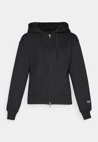 Crni zip-up dukserica od mekanog materijala, s prednjim džepom, kapuljačom na vezanje, rebrastim manžetama i malim logom na lijevoj strani prsa.