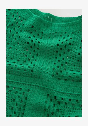 Green crocheted textile featuring a mix of open and closed weave patterns, with distinct horizontal and vertical bands of texture.