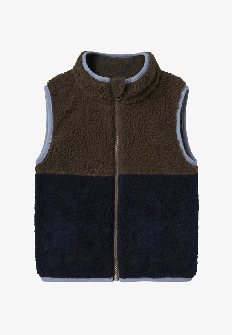 Pruun ja meresinine fliisvest kõrge kraega, lukuga ning sinise voodriga. Omab tekstuuriga mugavat kangast ja värvilahendusega disaini.