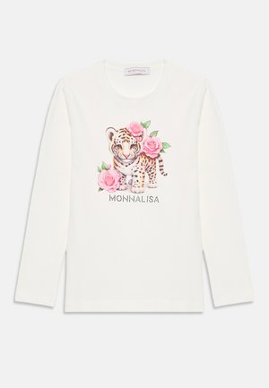 Hosszú ujjú fehér pamut póló, amelyen nyomtatott tigris minta található rózsaszín rózsákkal, alul pedig világosan kiemelt "MONNALISA" felirattal.