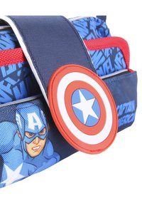 Blue fabric bag featuring Captain America design, red accents, and a circular shield emblem with a star in the center. Zippered compartment.