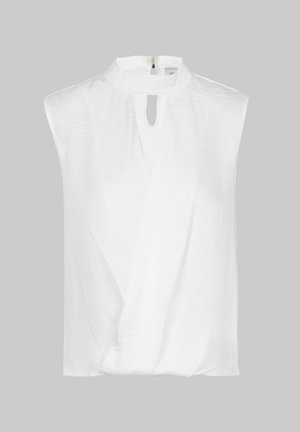 White sleeveless blouse with a high collar, featuring a front keyhole opening and textured fabric. Design includes asymmetric draping.