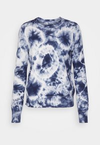 Marinblå och vit batikmönstrad långärmad sweatshirt med ribbstickade muddar och halsringning, med ett cirkulärt mönster och avslappnad passform.