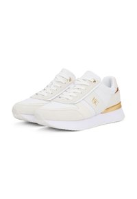 White athletic sneakers with a mix of leather and suede, featuring a gold accent and textured detailing on the side.