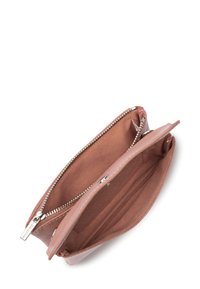 Pink leather clutch with a zip closure, featuring a smooth exterior and a soft interior lining, includes one compartment and a card slot.