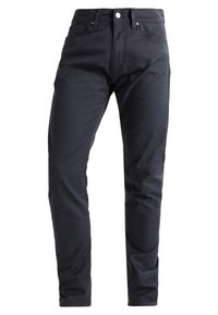 Mørkeblå jeans med slim fit, lavet af letvægts bomuldsstof. Har en knaplukning, fem lommer og diskrete sømdetaljer.