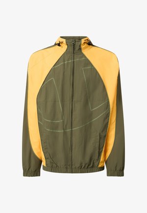 Oljčno zelena in rumena lahka jakna na zadrgo z visokim ovratnikom, elastičnimi manšetami in stranskimi žepi.