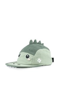 Grüne Mütze mit weicher Textur, die ein Dinosaurierdesign mit großen Augen und stacheligen Akzenten oben aufweist. Der Schirm ist flach und hat eine abgestepelte Detail.