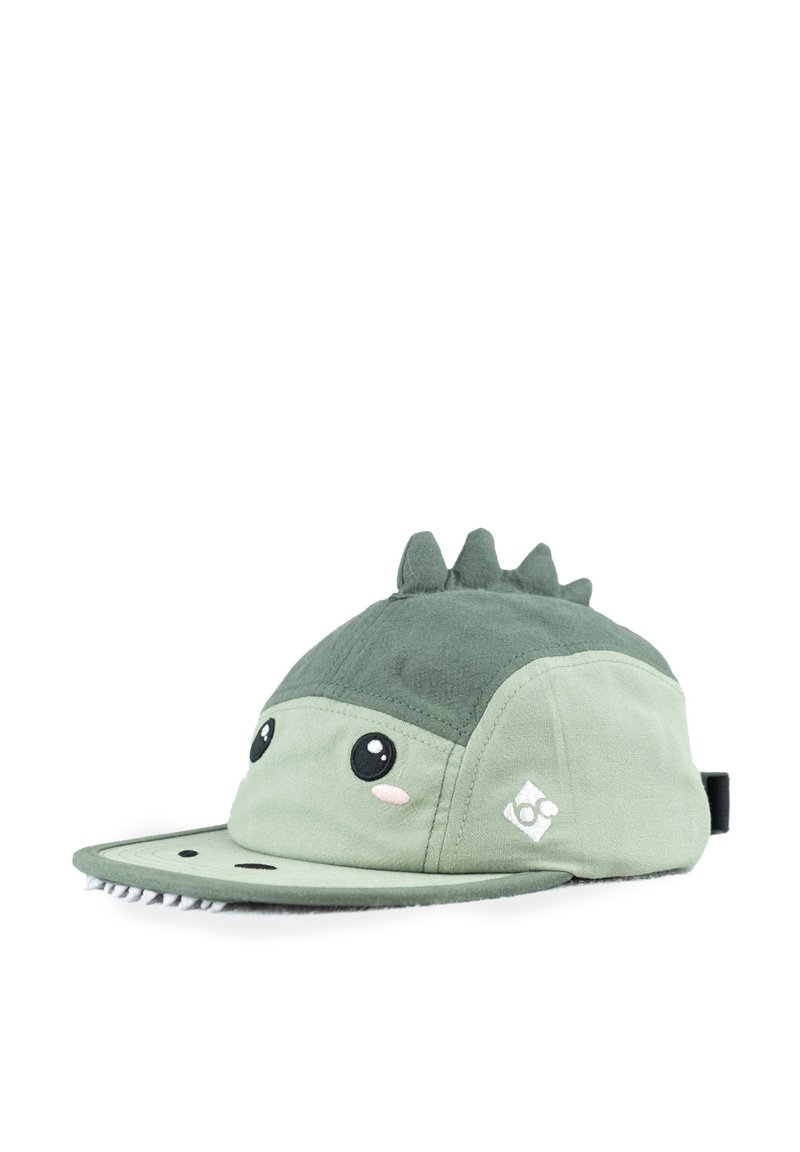 Grüne Mütze mit weicher Textur, die ein Dinosaurierdesign mit großen Augen und stacheligen Akzenten oben aufweist. Der Schirm ist flach und hat eine abgestepelte Detail.