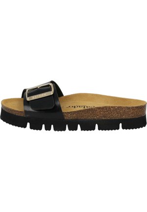 Black slide sandal with a wide strap featuring a metallic buckle, cork footbed, and textured rubber sole with deep grooves.