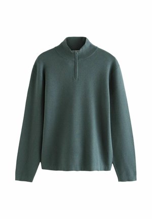 Roheline, pehme kampsun kõrge krae ja poolelt tõmblukuga. Omab pikki varrukaid ja lõdva istuvust. Kangas paistab kergelt ja sileda pinnaga.