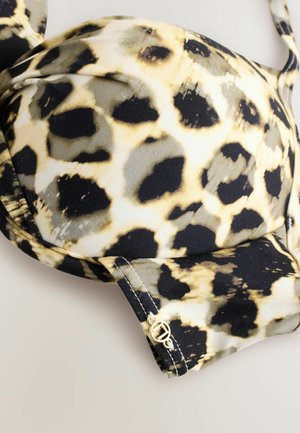 Grudnjak s jastučićima u leopardskom uzorku, s crnim, bež i sivoj točkicama te malim zlatnim okruglim logotipom na elastičnoj traci.