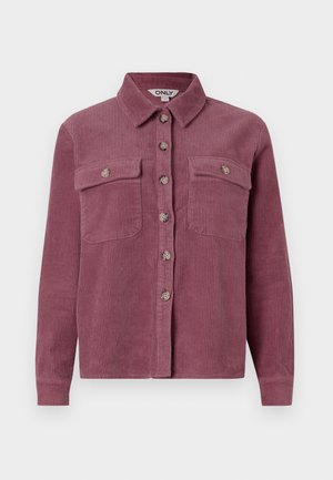 Kordfløjl skjorte i mauve med to brystlommer, krave og frontknaplukning; har teksturerede ribs og matchende knapper.