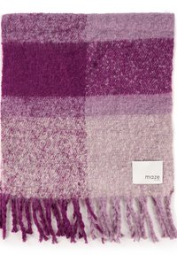 Purple and lavender woven blanket with varied textures, checkered pattern, and fringed edges. Label on one side reads "maze EST 2013."