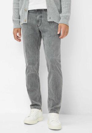 Gray denim jeans with a straight-leg fit, subtle faded texture, and front pockets, paired with white low-top sneakers.