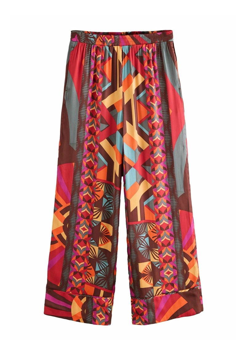Pantalon à jambes larges avec taille élastique comportant des motifs géométriques et floraux dans des tons orange, rouge, rose, bleu et marron.