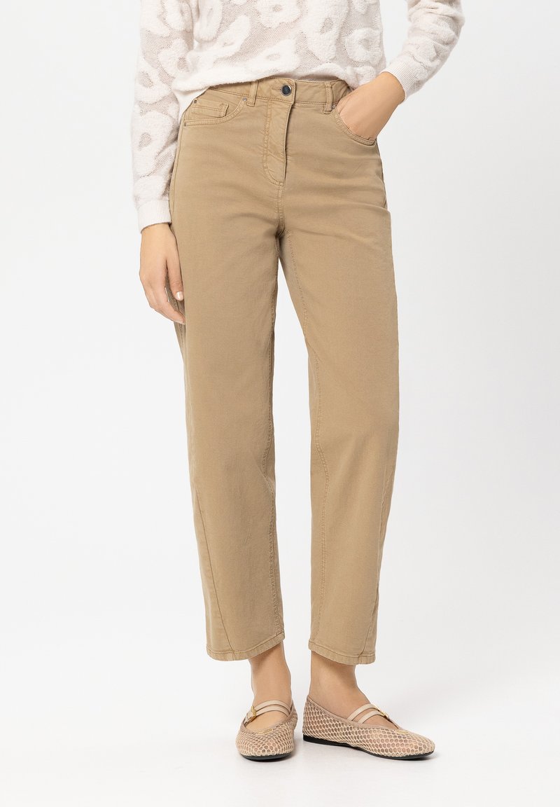 Beige cotton trousers with a relaxed fit, featuring a front button closure, side pockets, and a smooth, slightly textured surface.
