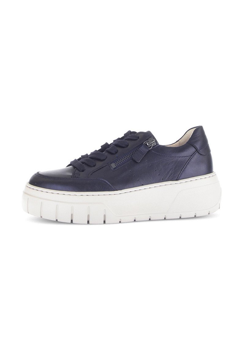 Navy leather sneaker with black laces, side zipper, and chunky white sole with deep grooves.