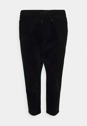 Pantalon en velours côtelé noir avec taille élastique et cordon de serrage, coupe droite, poches avant, et texture subtile à rainures verticales.