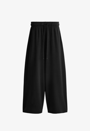 Black wide-leg cropped pants with elastic waistband and adjustable drawstring front, made of smooth fabric.