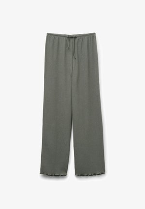 Pantalons en tissu léger et côtelé couleur vert foncé. Dotés d'une taille élastique avec cordon de serrage et de jambes évasées avec des bords festonnés.