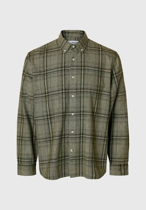 Roheline ruuduline särk, millel on kaelus, pikad varrukad ja mugav lõige. Omab peeneid musti ja halli jooni pehmest kangast.