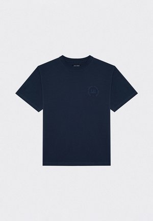 Dark navy blue t-shirt made of fabric, featuring a crew neck, short sleeves, and a circular logo print in a lighter shade on the chest.