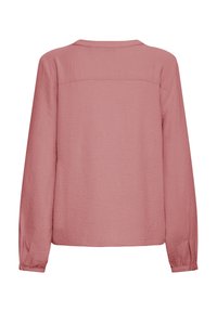 Langærmet bluse med afslappet pasform i et blødt, tekstureret støvet lyserødt stof. Den har rund halsudskæring og indsnævrede manchetter. Ingen synlige mønstre.