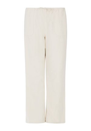 Beige wijde broek van zacht materiaal, voorzien van een elastische tailleband en twee zijzakken, met een gladde textuur en minimale details.