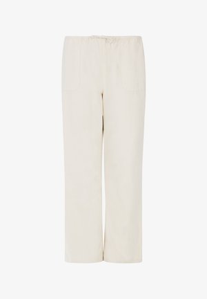 Beige wijde broek van zacht materiaal, voorzien van een elastische tailleband en twee zijzakken, met een gladde textuur en minimale details.