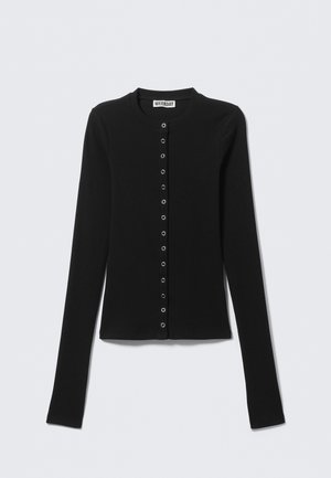 Cardigan noir à manches longues en tissu côtelé, doté d'un col rond et d'une patte de boutonnage avec des boutons argentés.