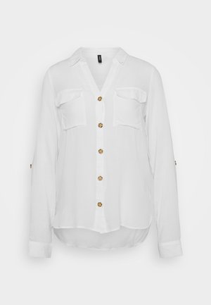 White long-sleeve shirt with a V-neck, two chest pockets, and six round buttons. Soft fabric with a slightly curved hem.