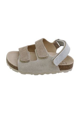 Sandalia infantil de ante beige con dos tiras de velcro delanteras, una tira de velcro en el tobillo, suela de corcho y suela exterior de goma beige texturizada.