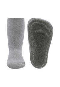 Szare skarpetki z prążkowanym wzorem, charakteryzujące się jednolitym kolorem oraz teksturowaną podeszwą z wzorami zapewniającymi dodatkową przyczepność.