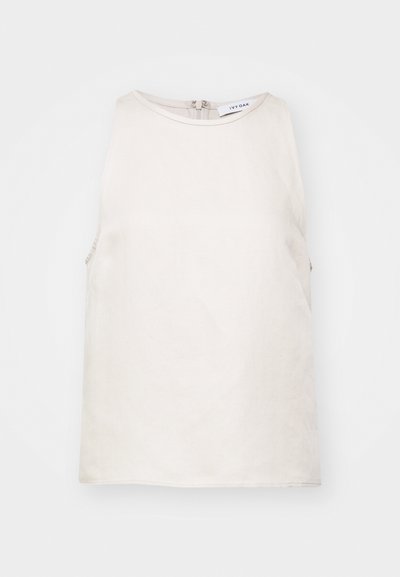Sleeveless light beige top made of soft fabric, featuring a round neckline and a concealed back zip closure. Simple and smooth texture.