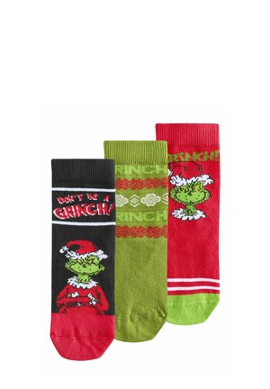 Tre par af julesokker: sorte med "Vær ikke en Grinch", grønne med mønster og røde med Grinch-grafik, alle i bomuldsblanding.