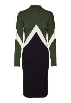 Gebreide jurk met hoge halslijn, met een groene bovenkant, wit zigzagpatroon en een zwarte rok. Lange mouwen en aansluitende pasvorm.