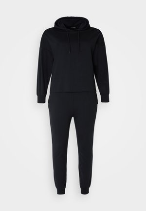 Black hoodie and jogger set made from soft fabric, featuring a hood, long sleeves, and fitted cuffs for a relaxed fit.
