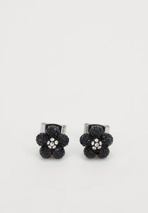 Pendientes florales negros con una textura brillante, presentando acentos de cristal en el centro. Herrajes de metal con un acabado brillante.