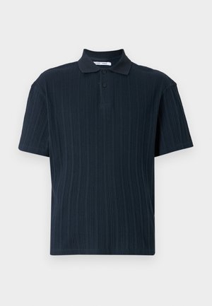 Navy blue short-sleeve polo shirt featuring textured ribbed fabric, a classic collar, and three button placket.
