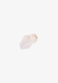 White cream textured with smooth and ridged patterns, shaped in a wavy form against a plain background.