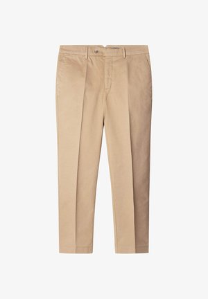 Beige kokvilnas bikses ar veidotu piegriezumu, ar priekšējiem ieplākumiem, sānu kabatām un pogu aizdari. Gluda virsma, taisnas kāju dizains.